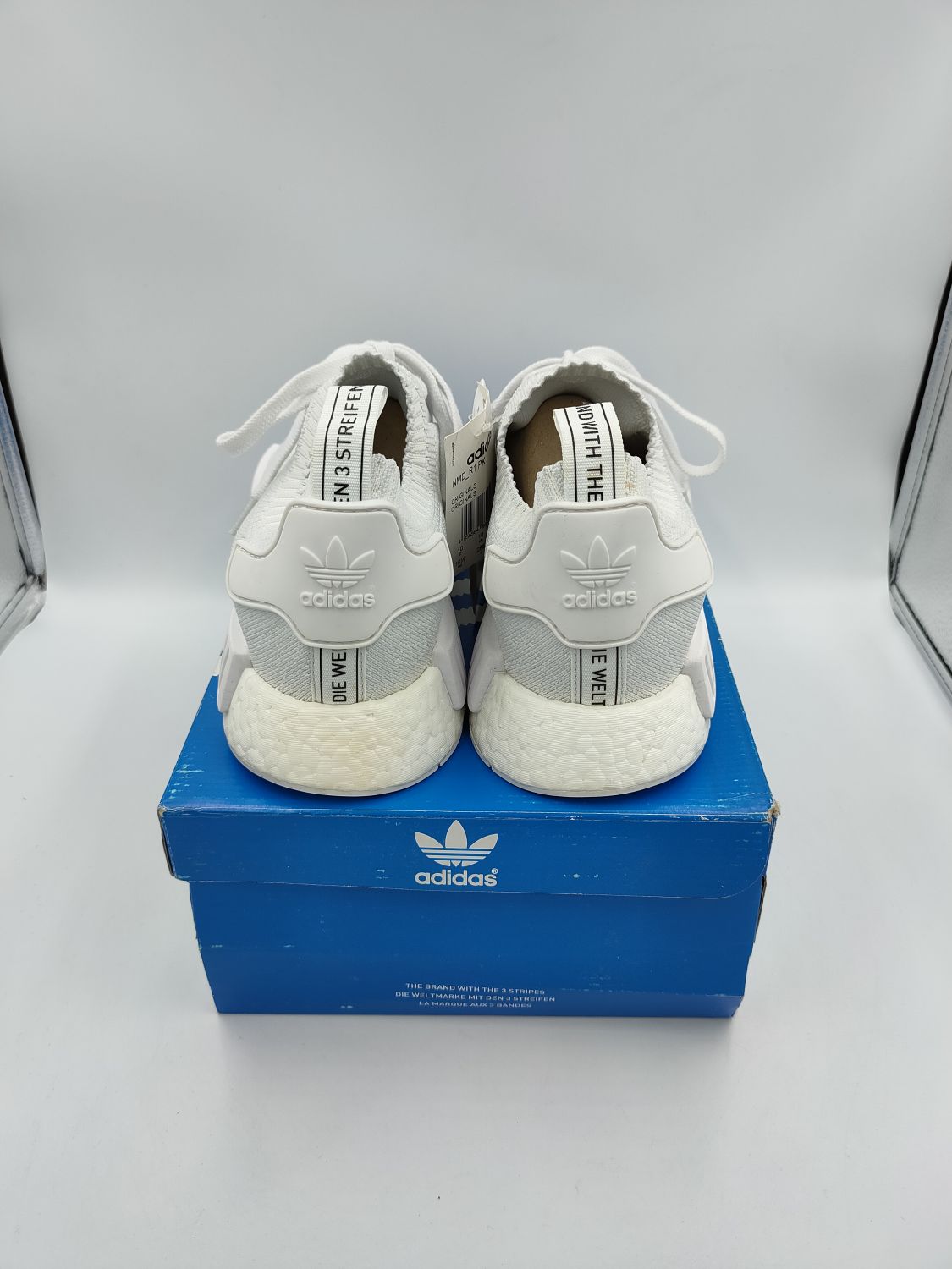 Nmd r1 outlet triple white price