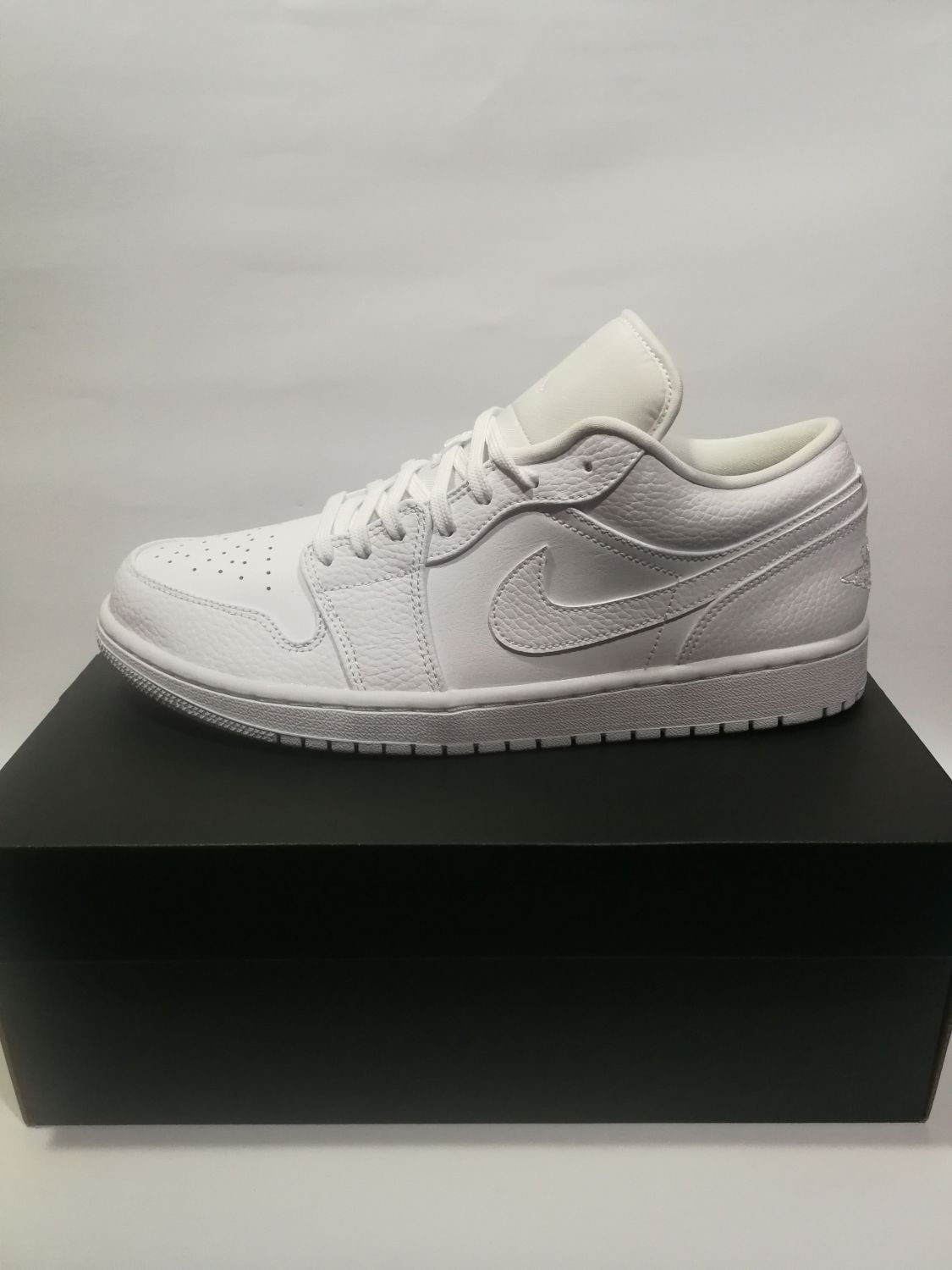 air jordan 1 low features heavy tumbled tan leather