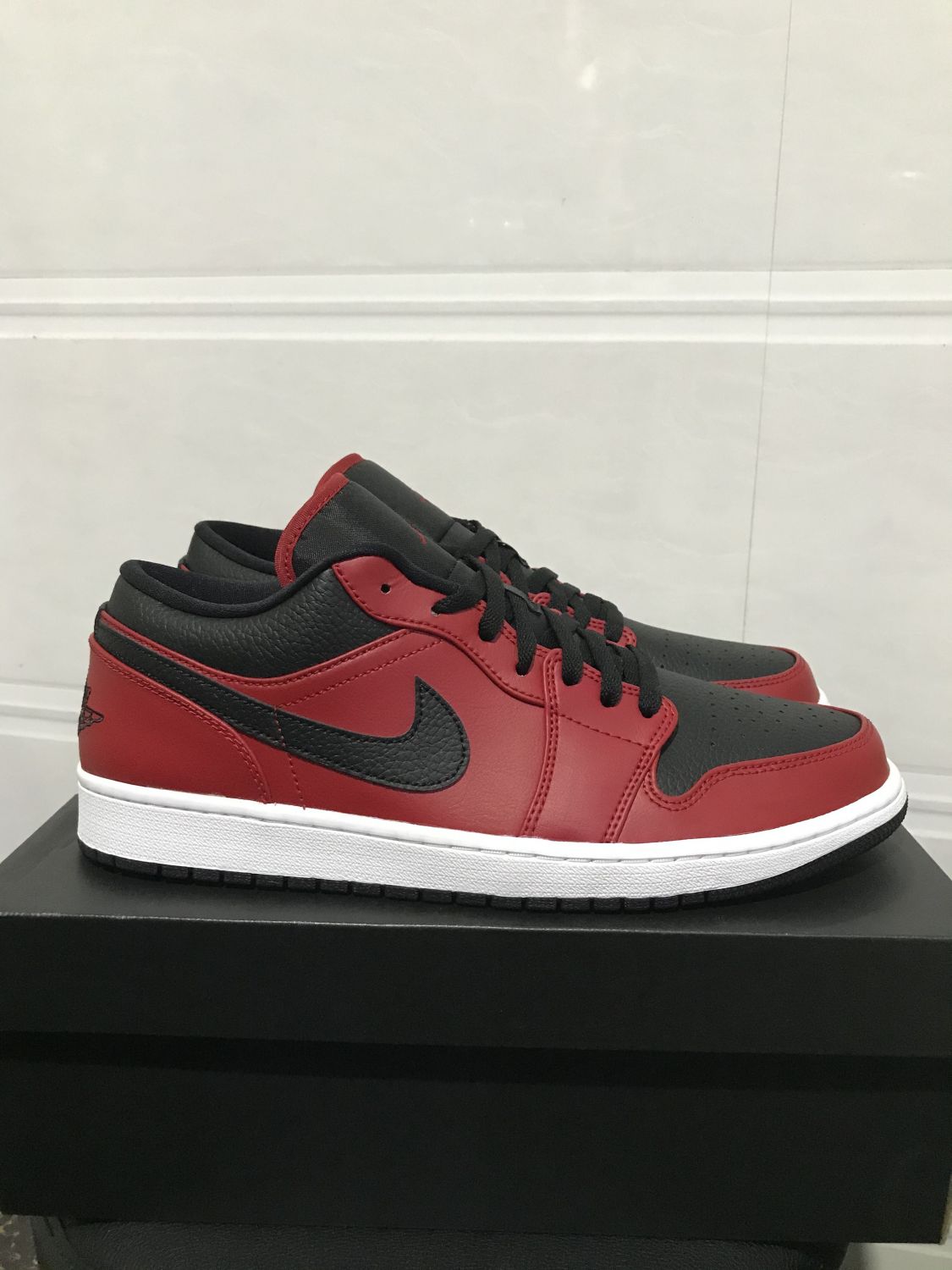 Jordan 1 Low Reverse Bred Pebbled Swoosh | AfterMarket