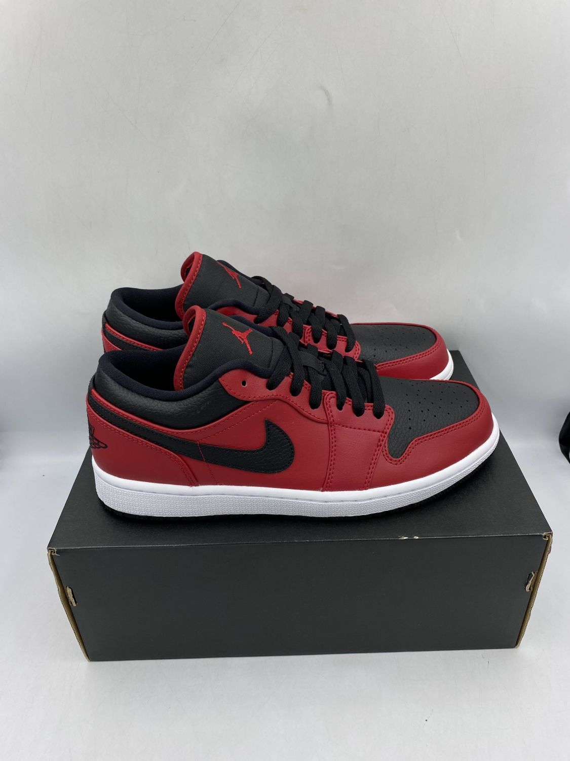 Jordan 1 Low Reverse Bred Pebbled Swoosh Aftermarket